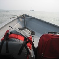 Backpack and luggage on the way to Tiomon Island